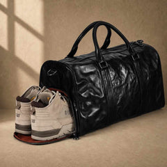 Black cowhide leather weekender with separate shoe compartment holding footwear