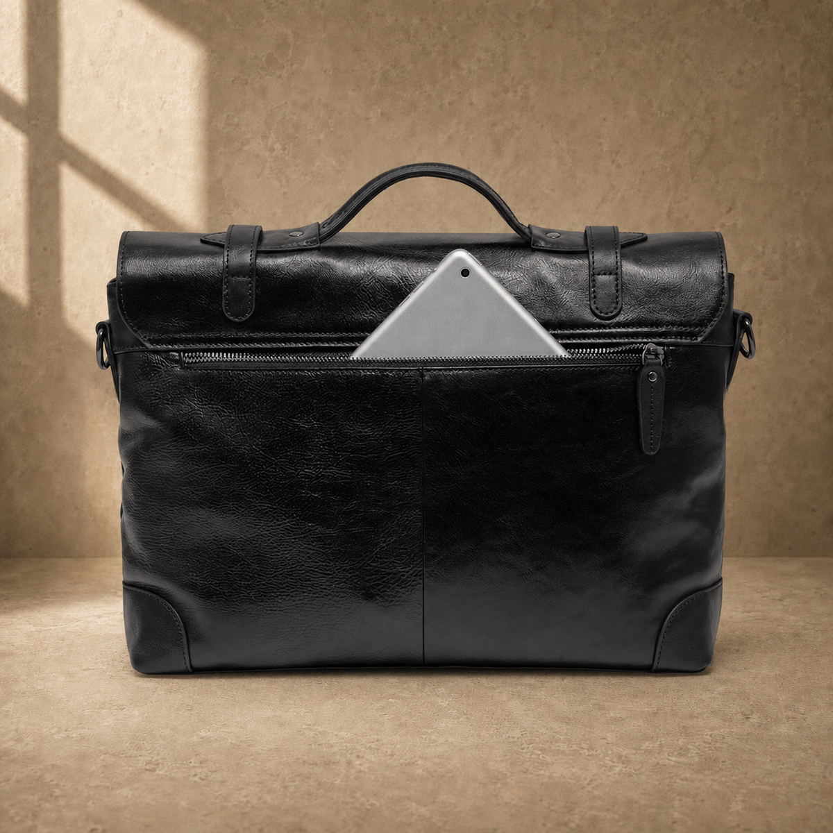 Black leather commuter messenger bag, rear zipper pocket view