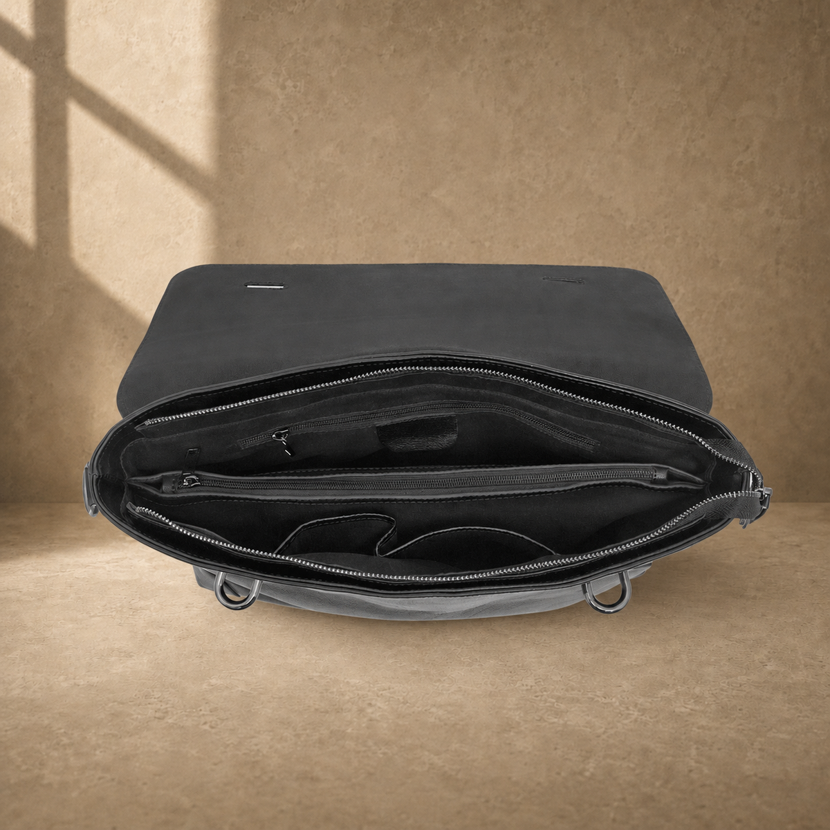 Black leather commuter messenger bag, empty organized interior
