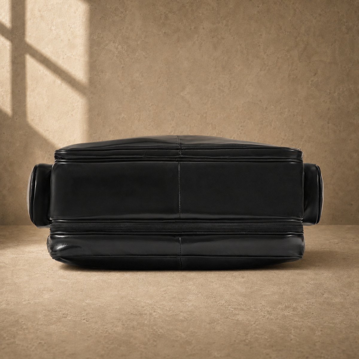 Black leather multi-pocket briefcase, reinforced base view