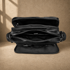 Black leather multi-pocket briefcase, open empty compartments