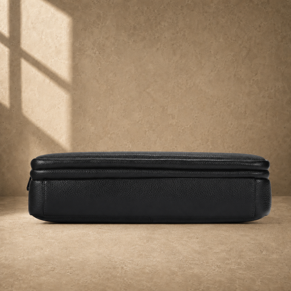 Black leather multi-pocket briefcase, reinforced base