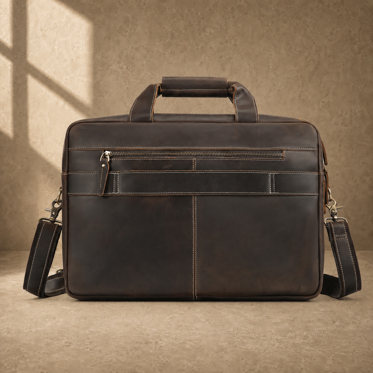 Brown leather multi-pocket briefcase, rear zipper pocket view
