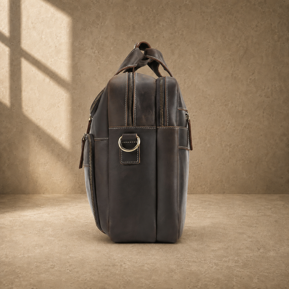 Brown leather multi-pocket briefcase, side profile