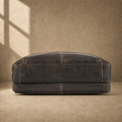 Brown leather multi-pocket briefcase, reinforced base view
