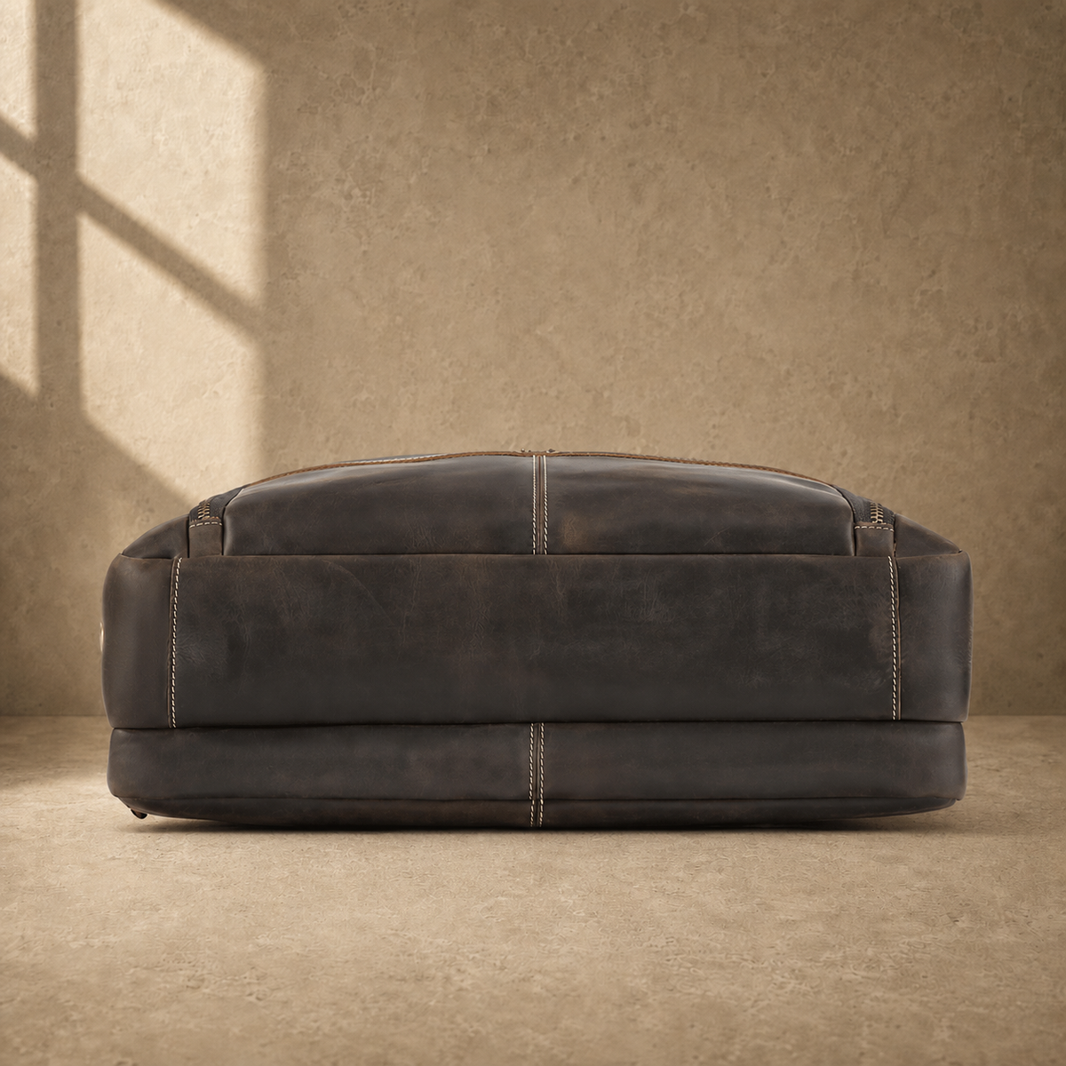 Brown leather multi-pocket briefcase, reinforced base view