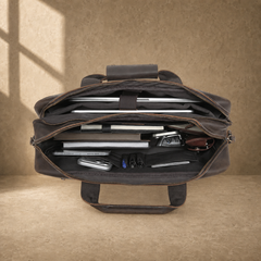 Brown leather multi-pocket briefcase, packed laptop compartment