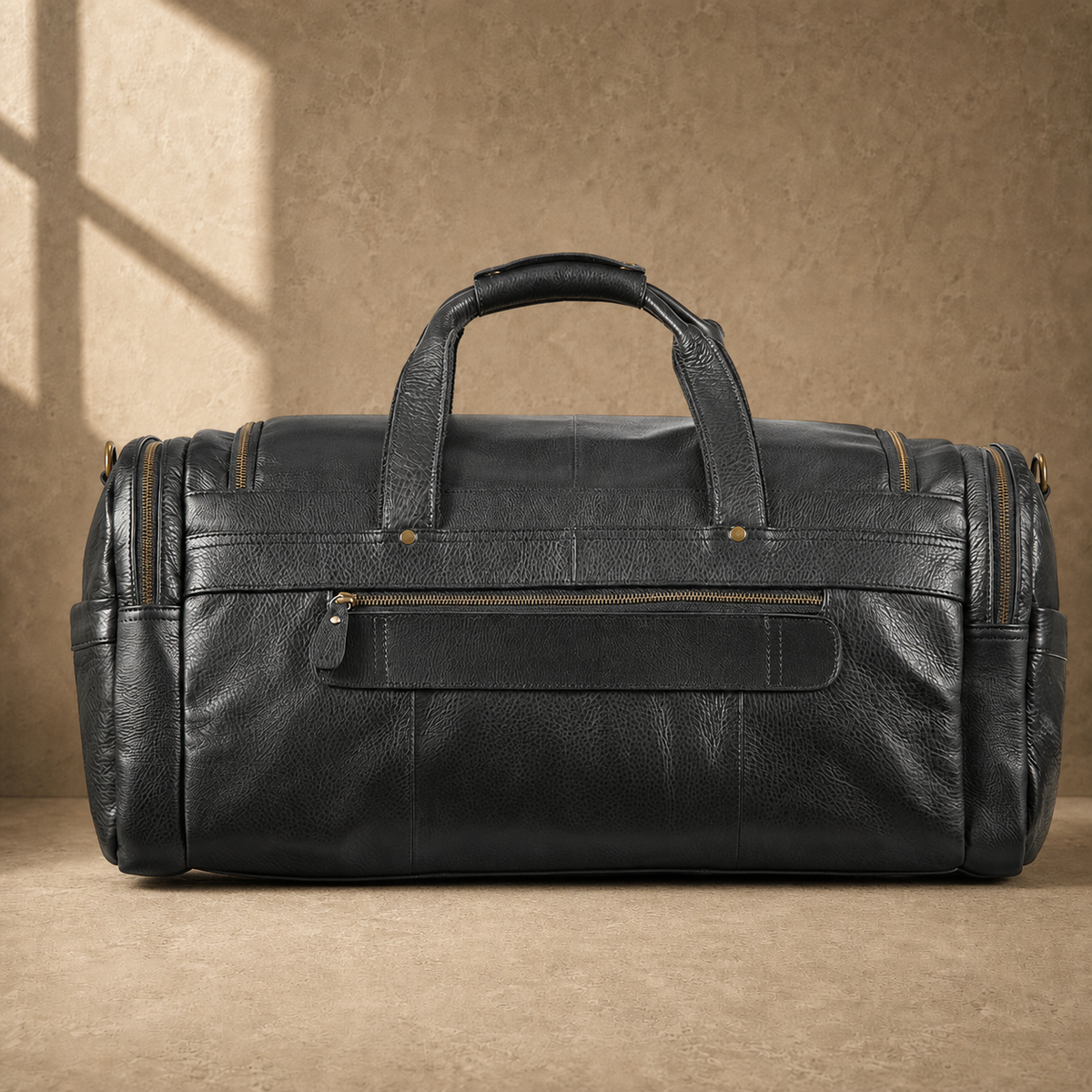 Black waxed leather organizer duffel, rear zipper pocket
