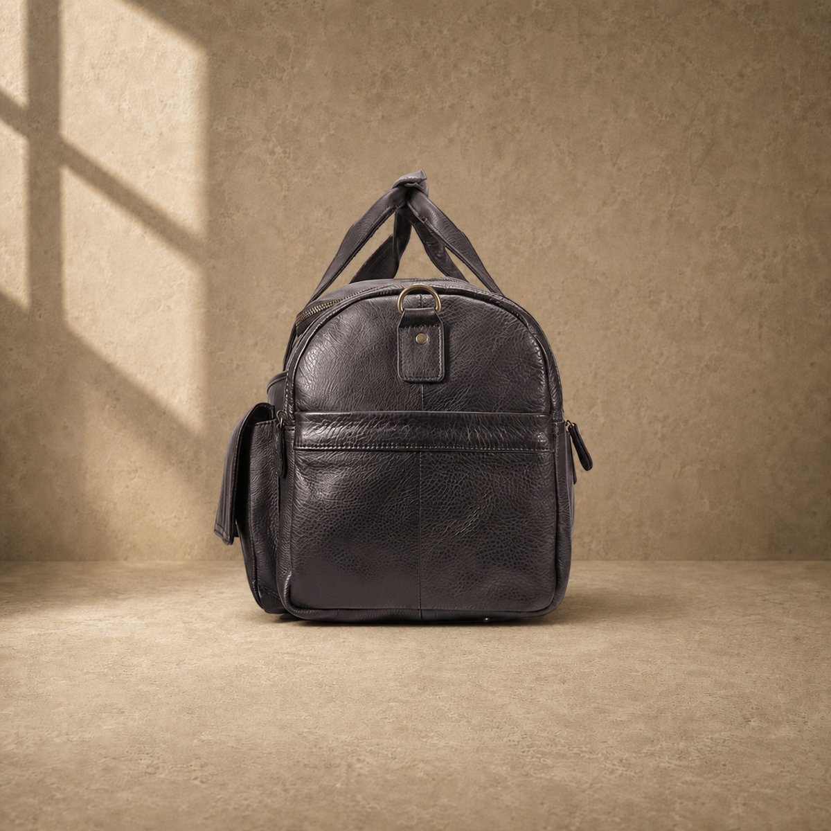 Coffee brown leather utility travel duffel, end profile