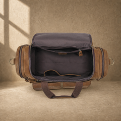 Dark brown leather utility weekender showing empty organized interior