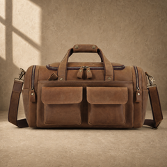 Dark brown leather utility weekender with shoulder strap, front view