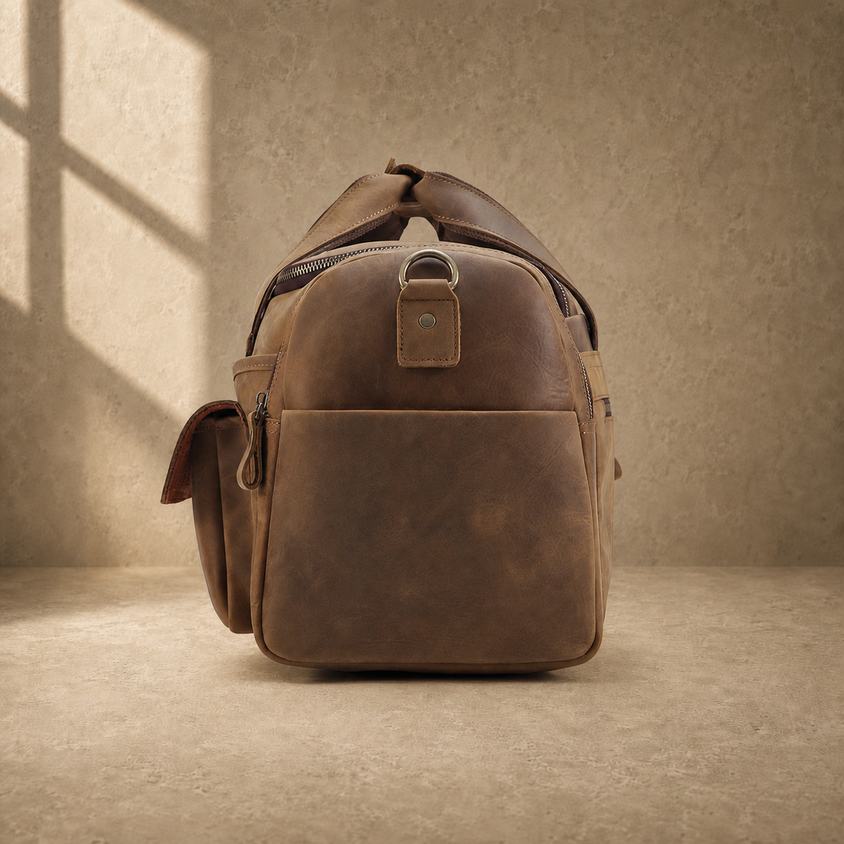 Dark brown leather utility weekender, side profile