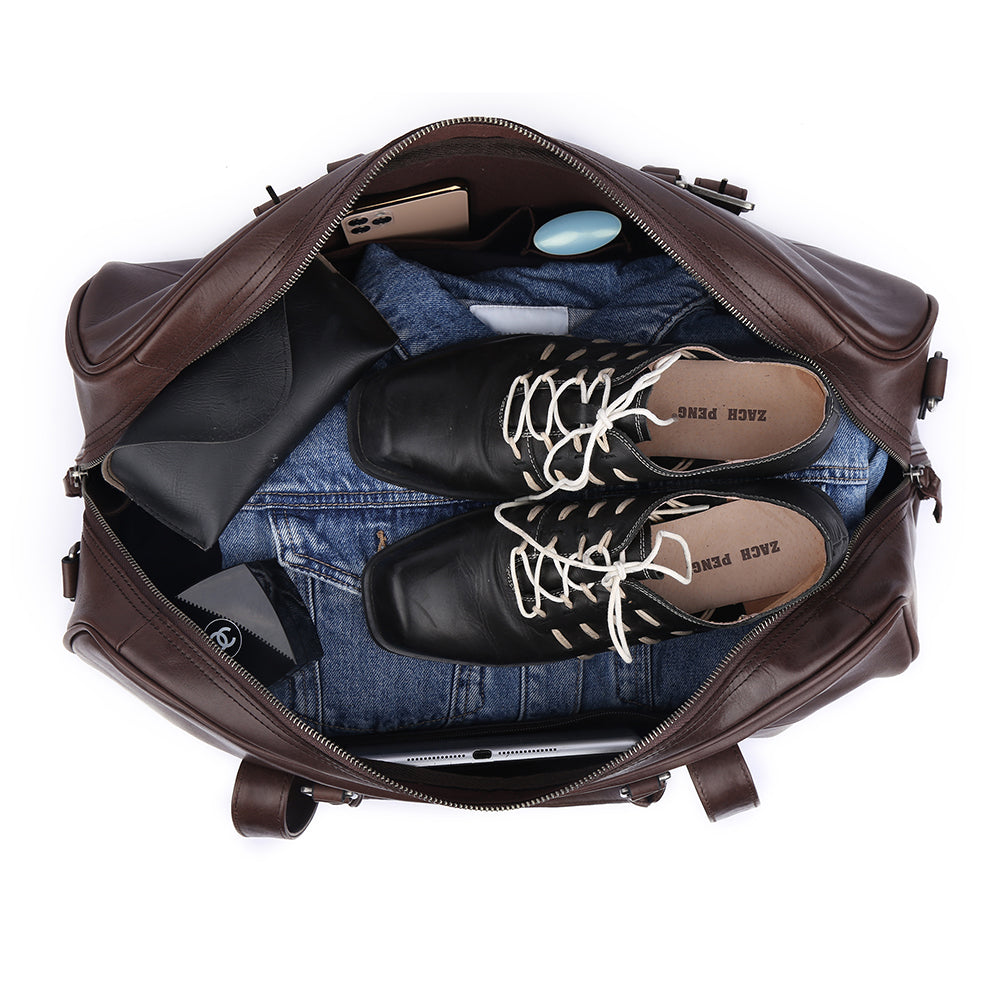 Open weekender packed with clothing, shoes and daily essentials