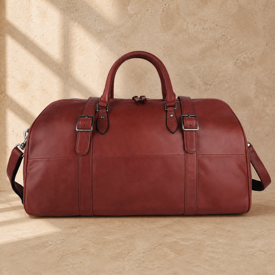Burgundy leather large weekender bag with shoulder strap, front view