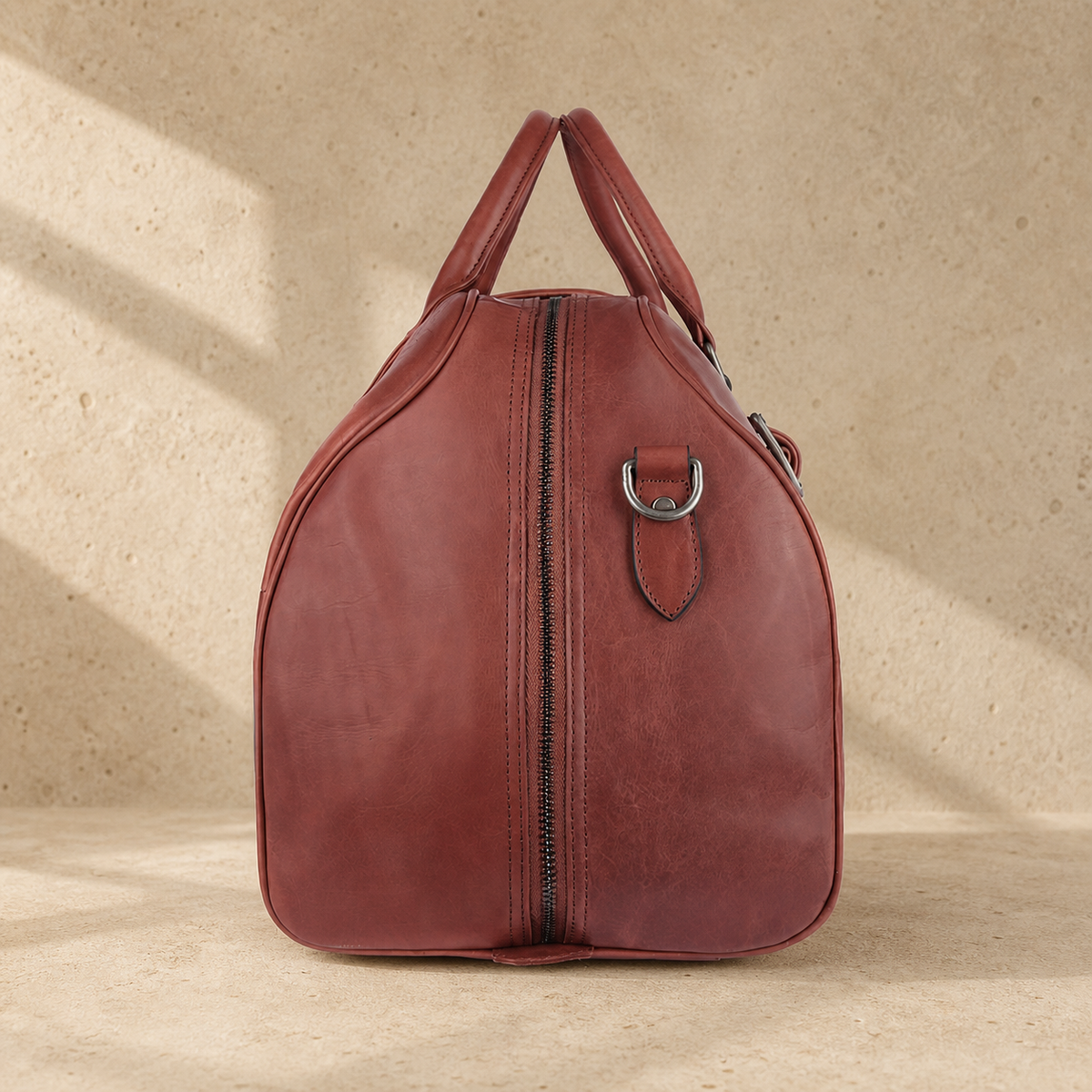 Burgundy leather large weekender bag, side view