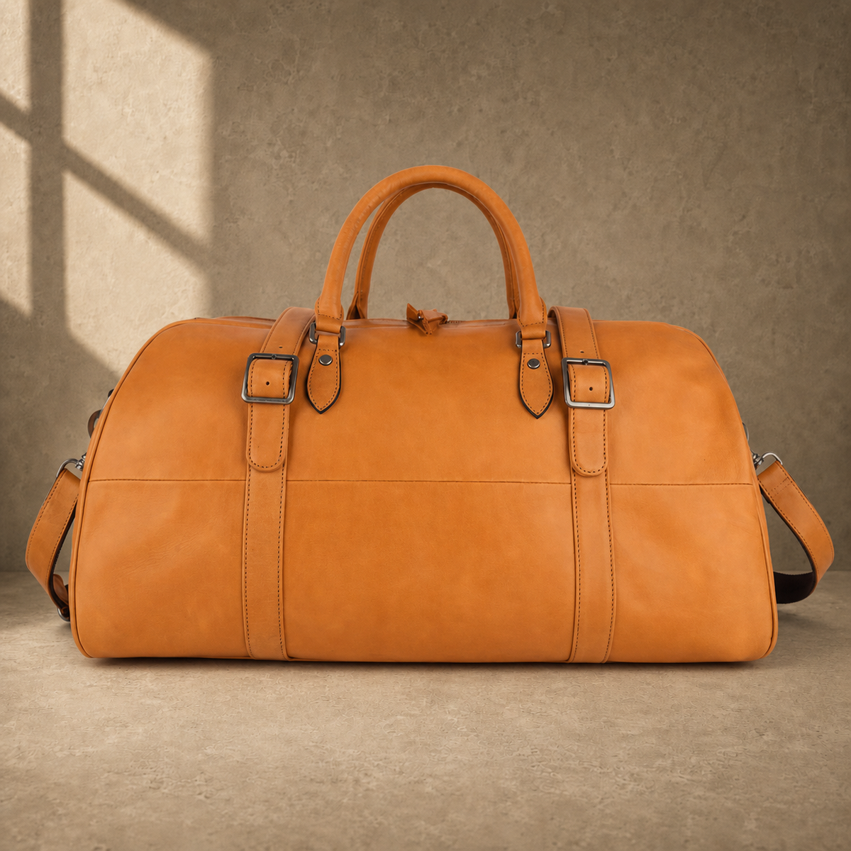 Cognac classic weekender duffel with shoulder strap, front view