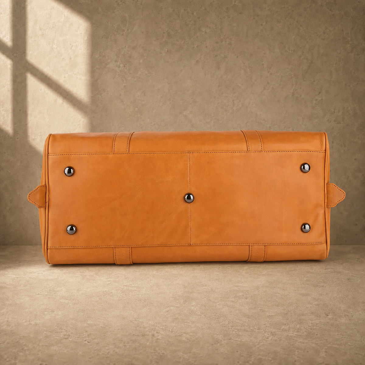 Cognac classic weekender duffel with protective base feet