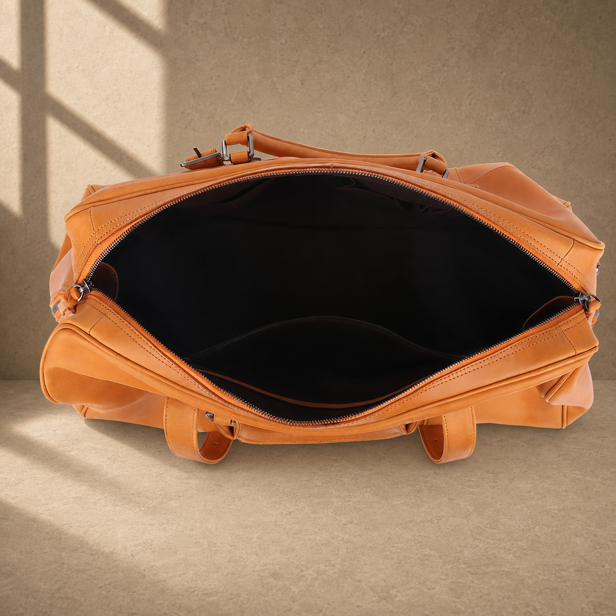 Cognac classic weekender duffel showing empty interior