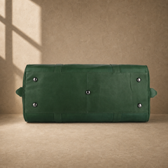 Forest green leather large weekender duffel showing protective base feet