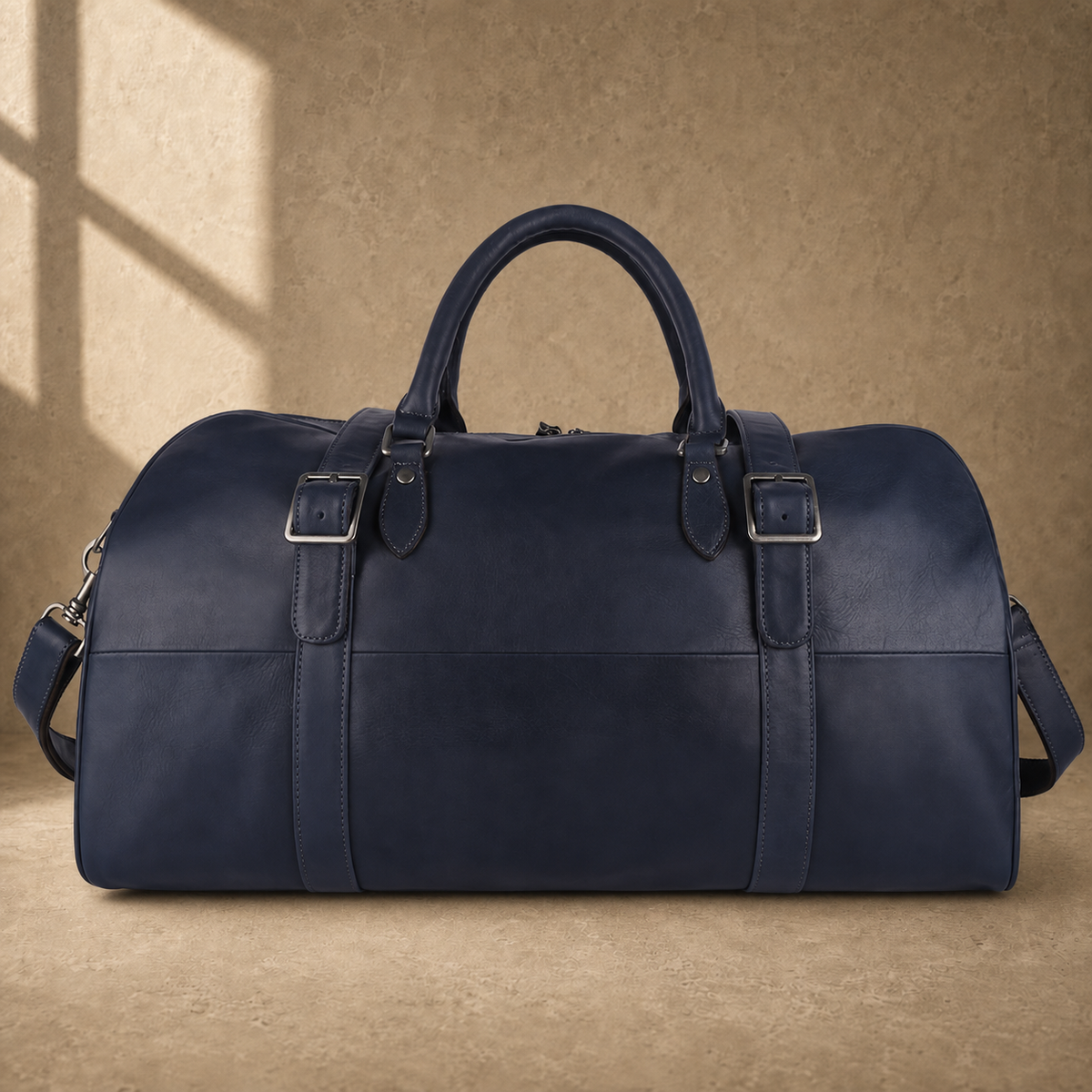Navy structured buckle travel duffel, front view with shoulder strap