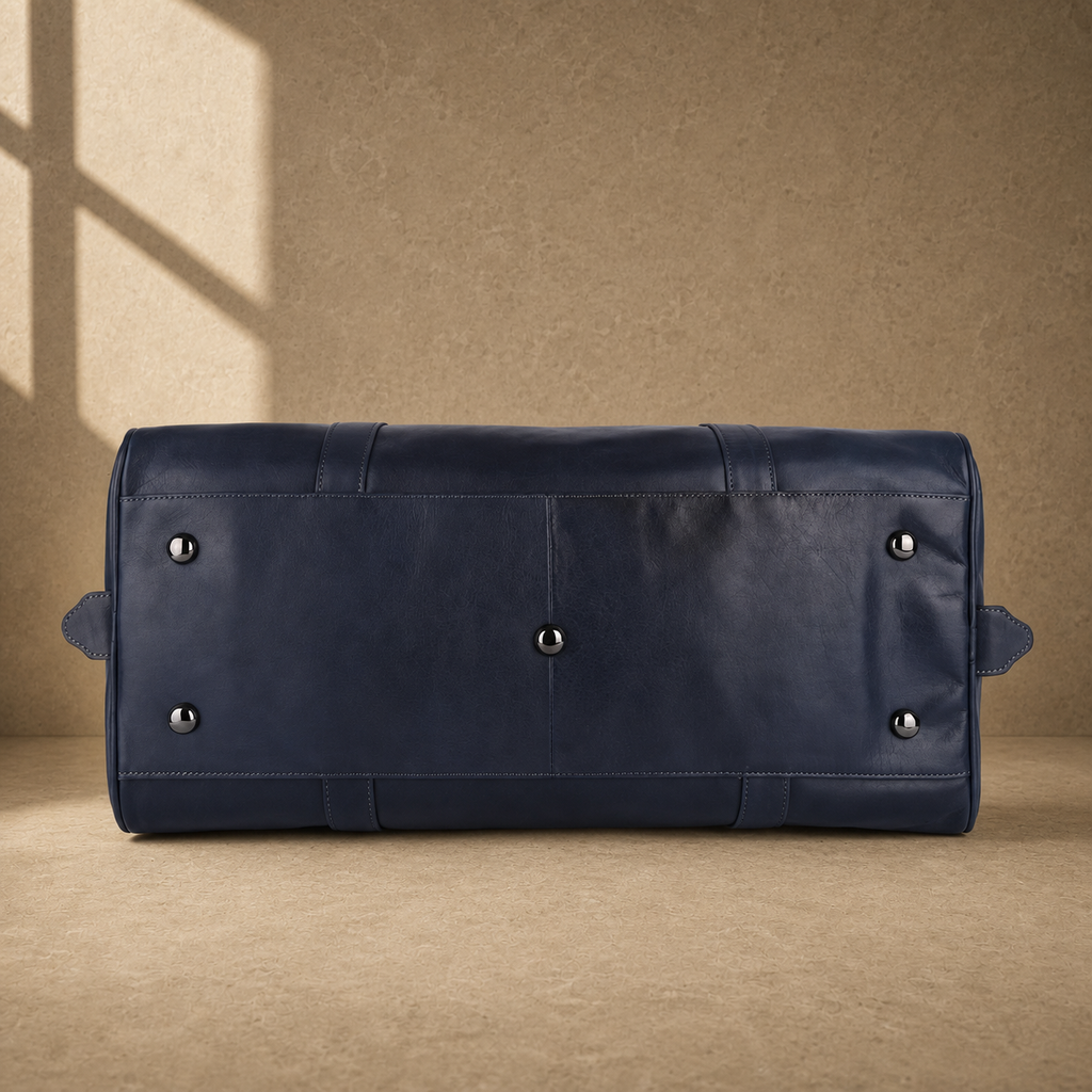 Navy structured buckle travel duffel with protective base feet