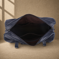 Navy structured buckle travel duffel showing empty interior