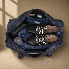 Navy structured buckle travel duffel showing packed capacity