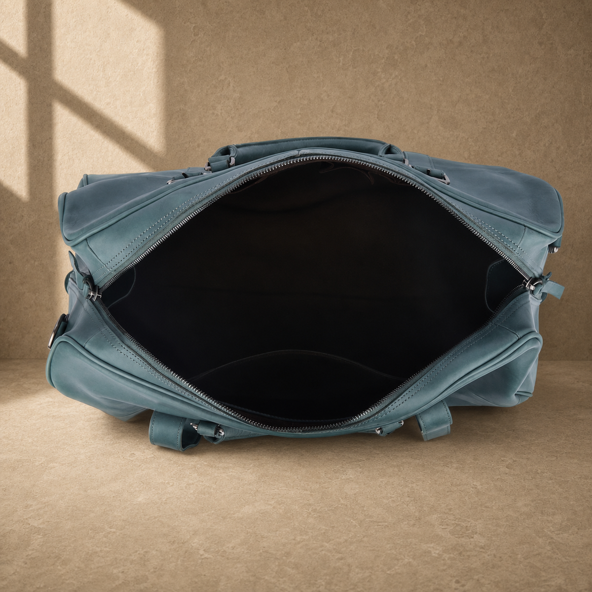 Sky blue structured weekender duffel showing empty interior
