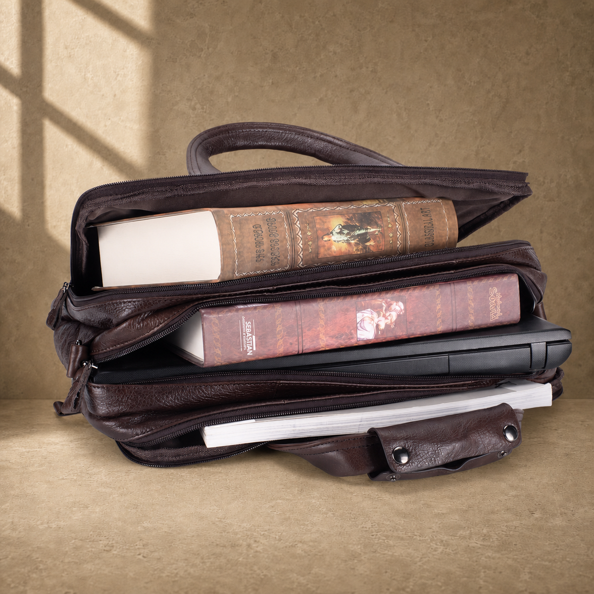 Coffee brown leather laptop work bag, packed three-compartment capacity view