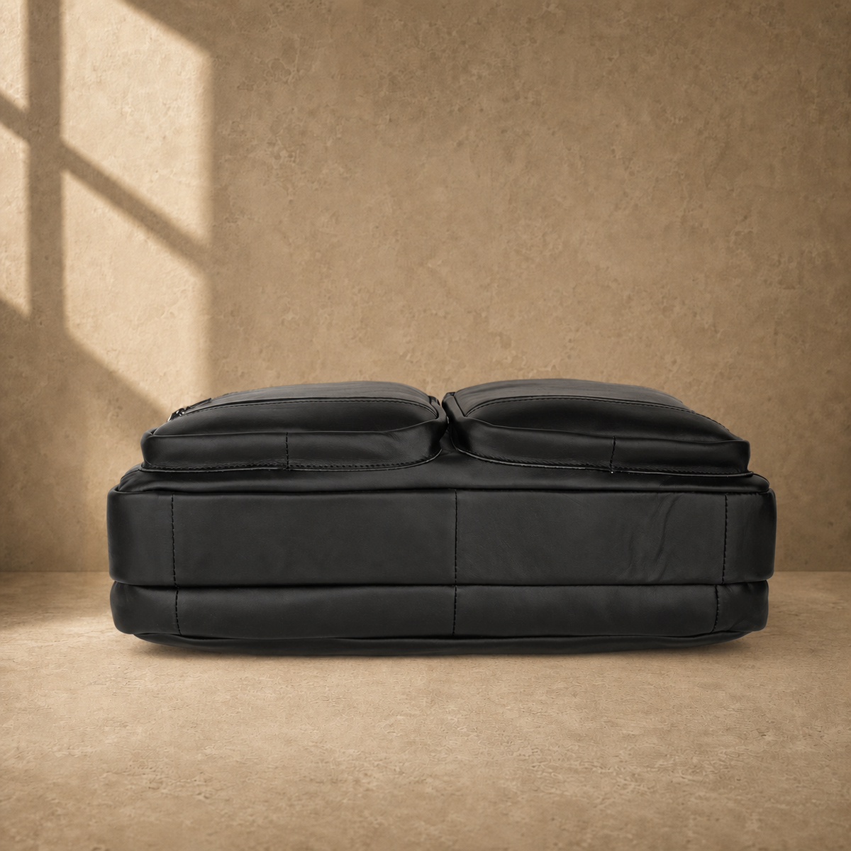 Black cowhide multi-pocket briefcase reinforced base view