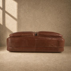 Brown cowhide dual-zip briefcase bag, reinforced base view