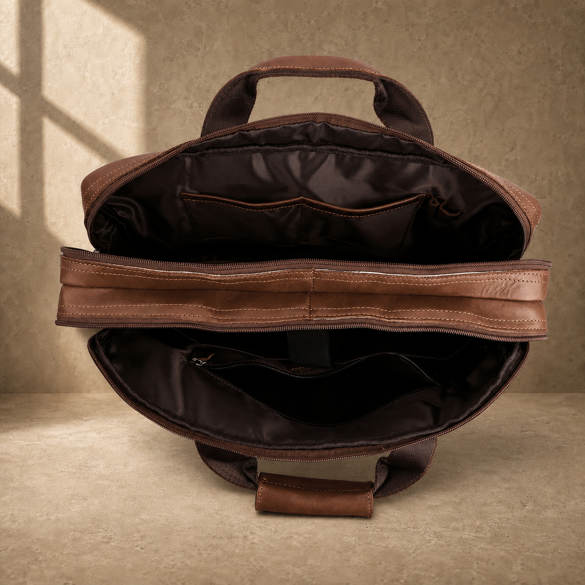 Brown cowhide dual-zip briefcase bag, empty compartment view