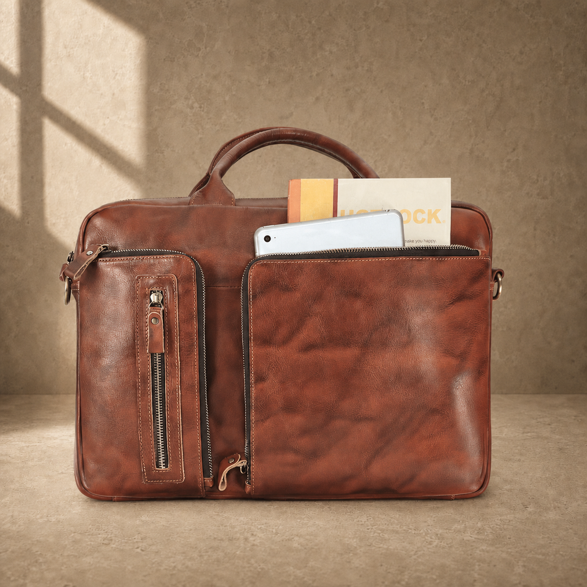 Brown cowhide leather work briefcase, packed front pocket capacity view