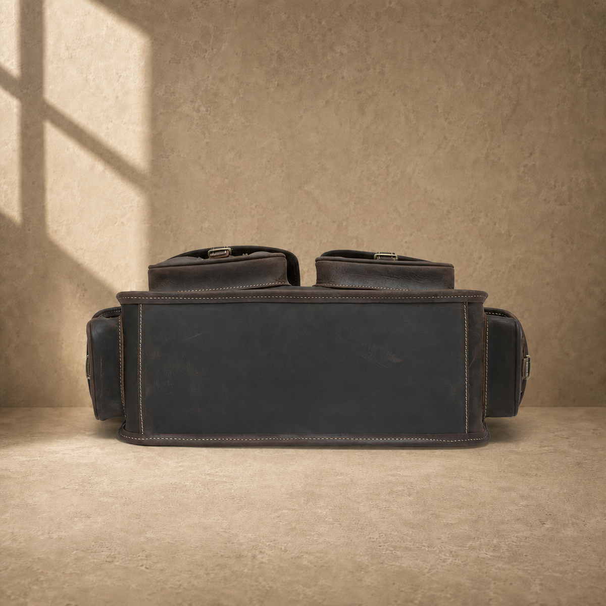 Coffee brown leather camera work bag, reinforced base view