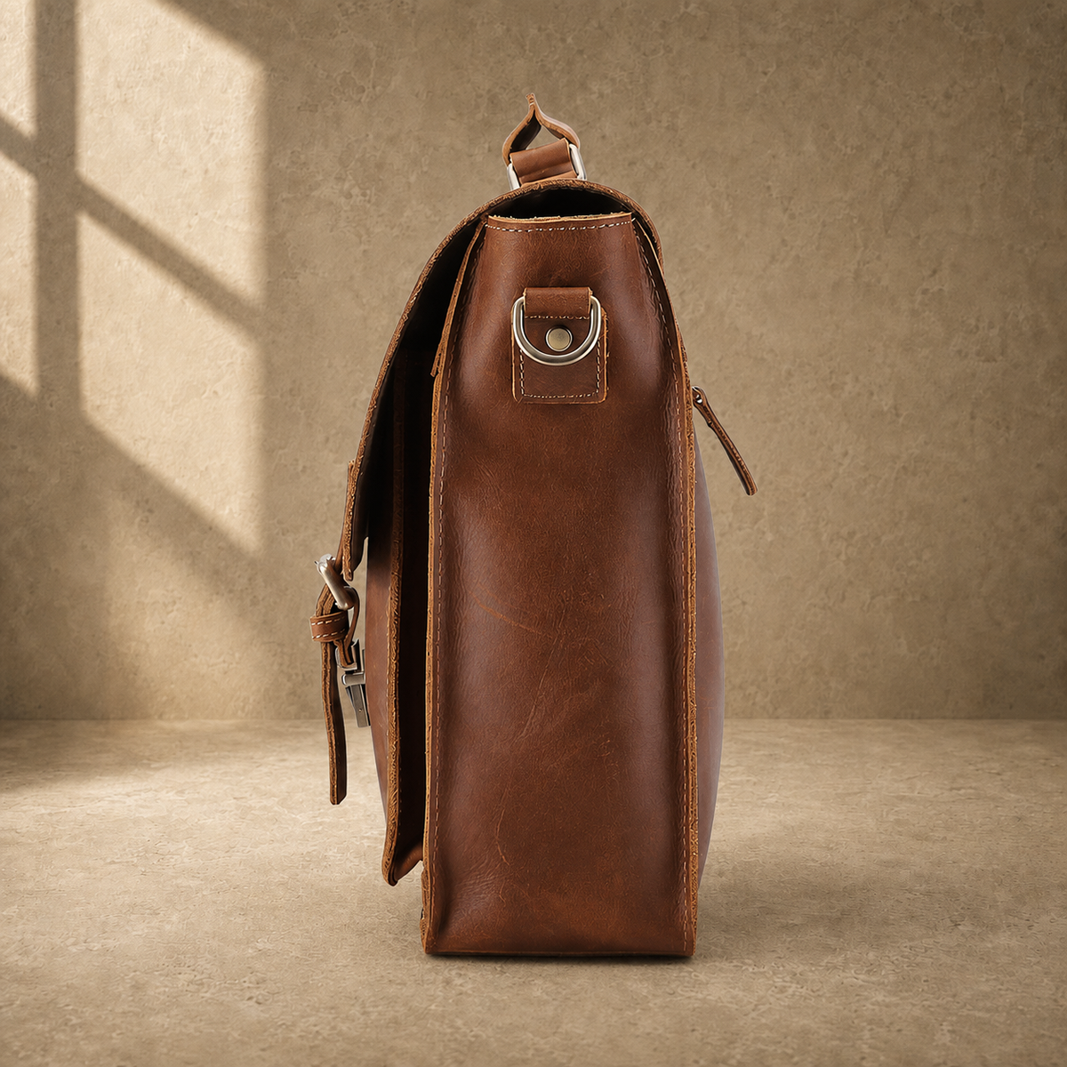 Brown leather buckled work briefcase side profile