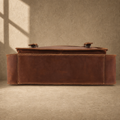 Brown leather buckled work briefcase reinforced base view