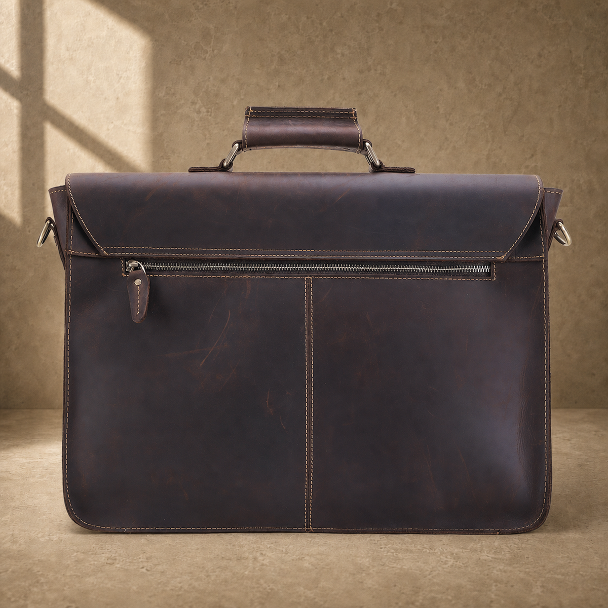 Coffee brown leather buckle briefcase rear zipper pocket view