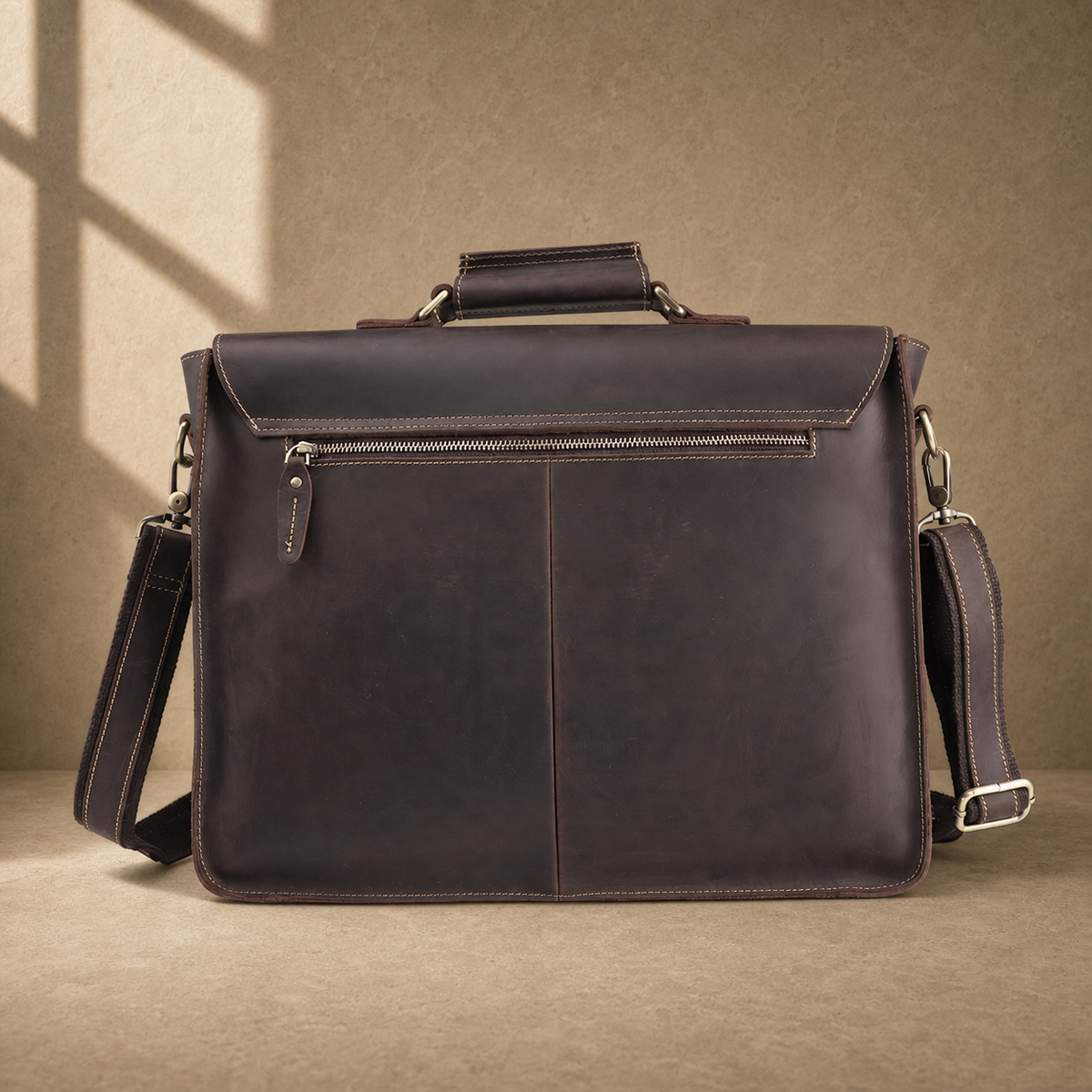 Deep coffee leather buckle briefcase rear view with zipper pocket