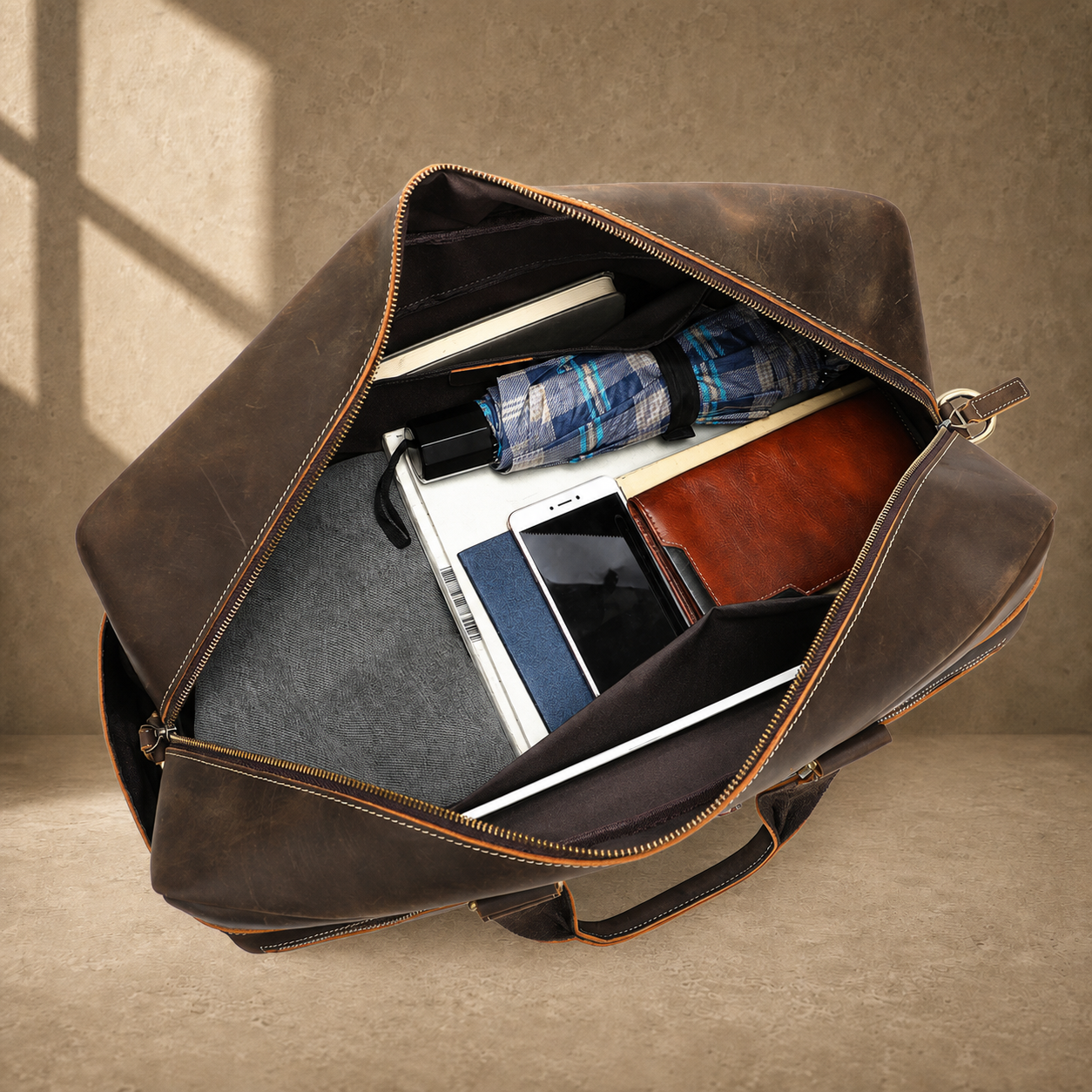 Deep coffee leather weekender duffle, packed main compartment