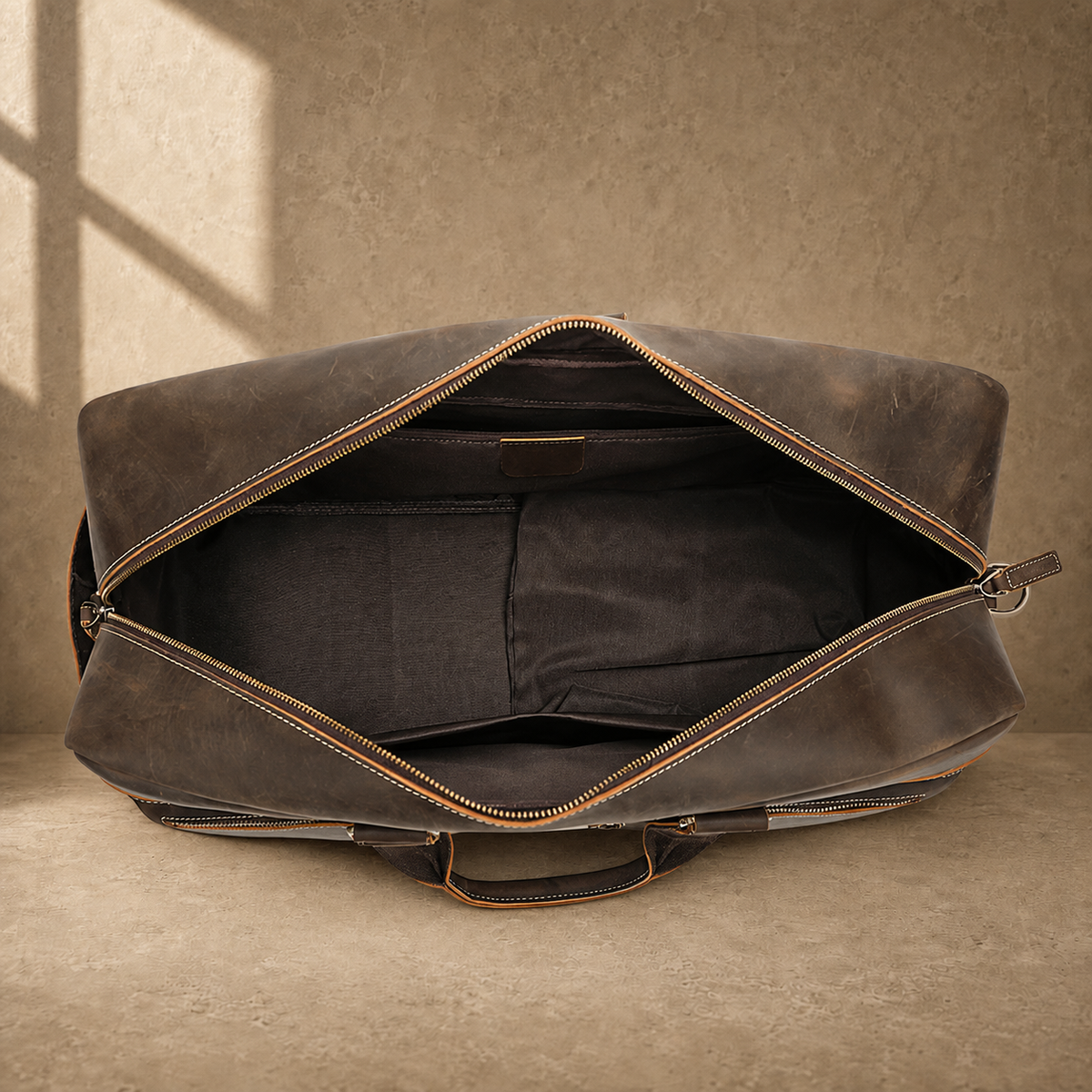 Deep coffee leather weekender duffle, empty interior organizer view