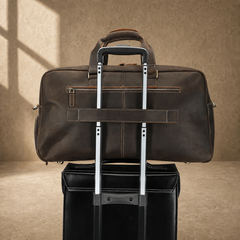 Deep coffee leather weekender duffle, trolley sleeve on luggage