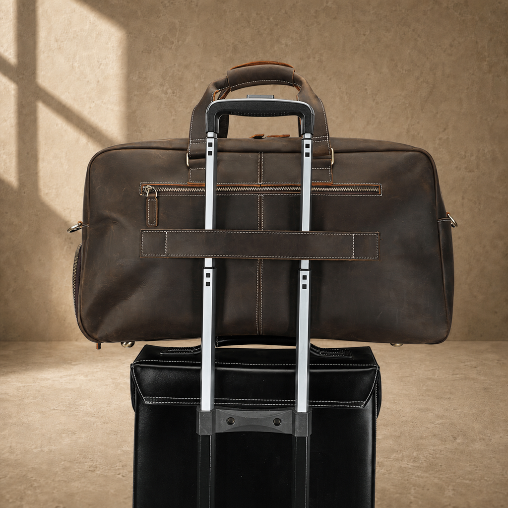 Deep coffee leather weekender duffle, trolley sleeve on luggage