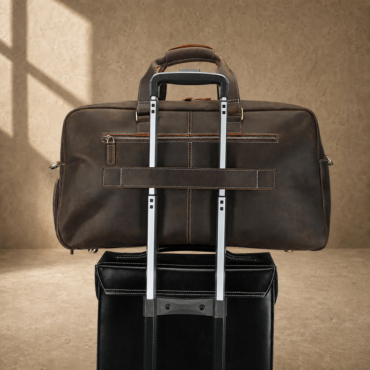Deep coffee leather weekender duffle, trolley sleeve on luggage