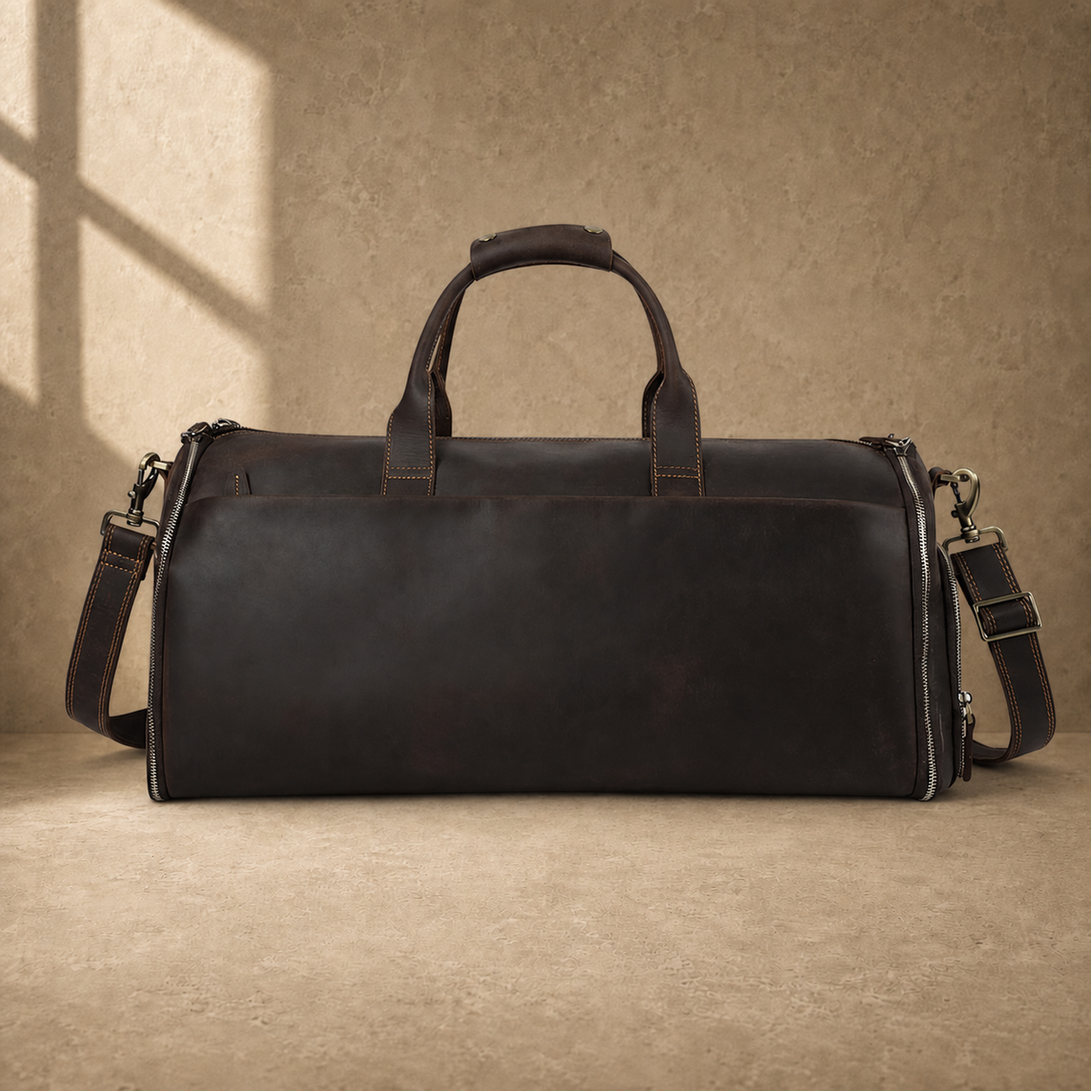 Deep coffee cowhide garment weekender duffel studio view