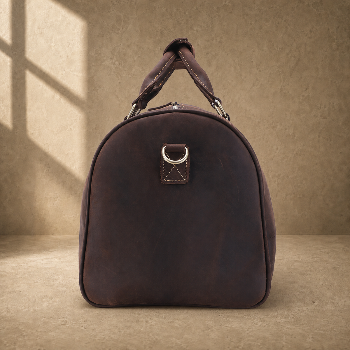 Rustic brown travel duffel side view