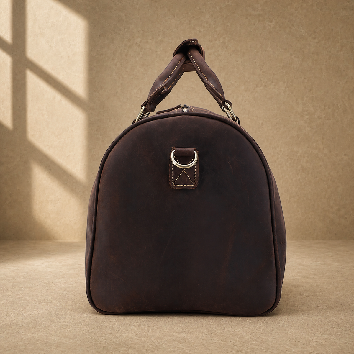 Rustic brown travel duffel shoe pocket detail